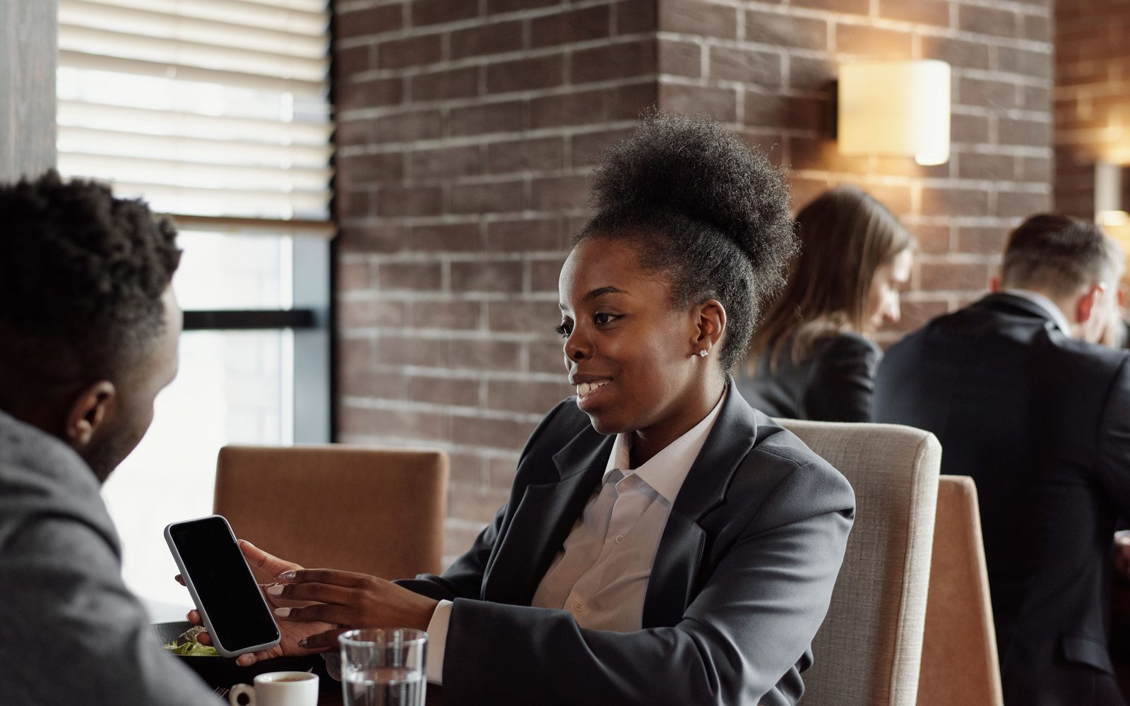 Team collaborating around a laptop